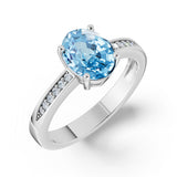 Zlatý dámský prsten DF 3384 z bílého zlata, s topazem Swiss Blue a diamanty